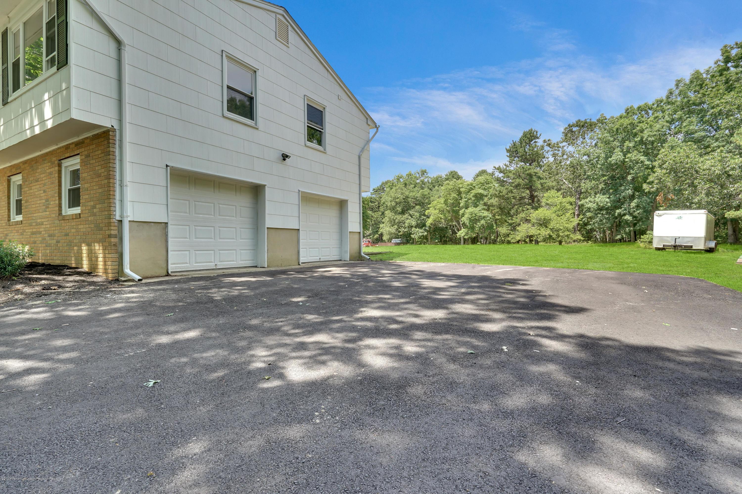 30 Jackson Mills Road Jackson, NJ 08527 - Photo 36 of 37 a view of a house with a yard and garage