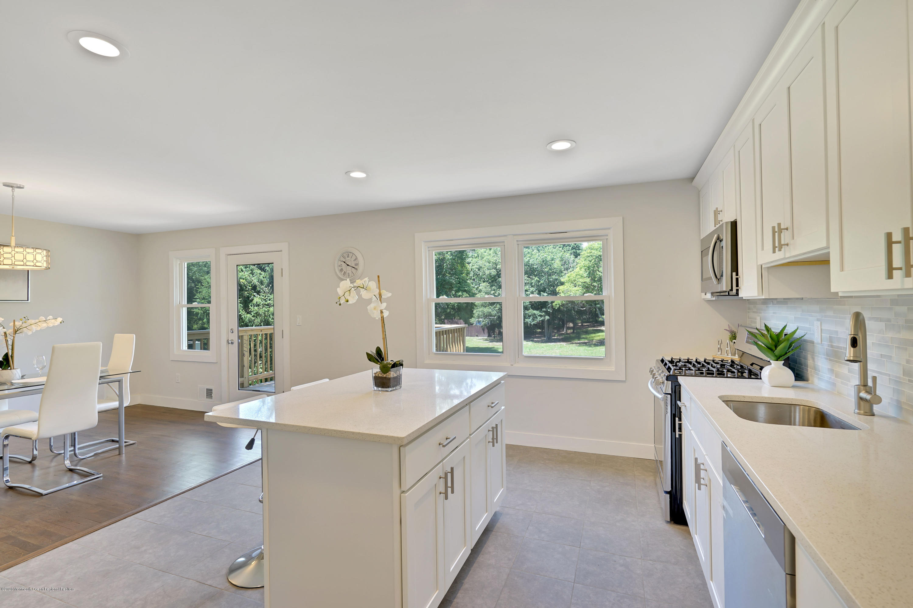 30 Jackson Mills Road Jackson, NJ 08527 - Photo 4 of 37 a kitchen that has a sink a stove and wooden floor