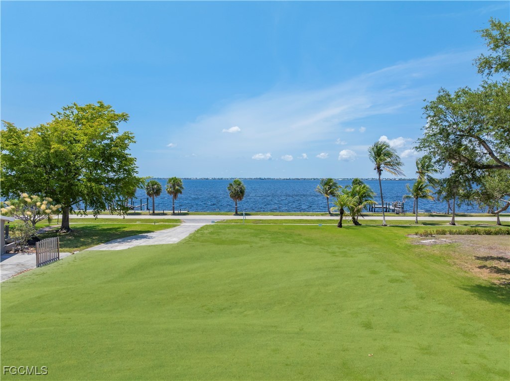 6105 West Riverside Drive Fort Myers, FL 33919 - Photo 2 of 8 a view of an swimming pool and outdoor space