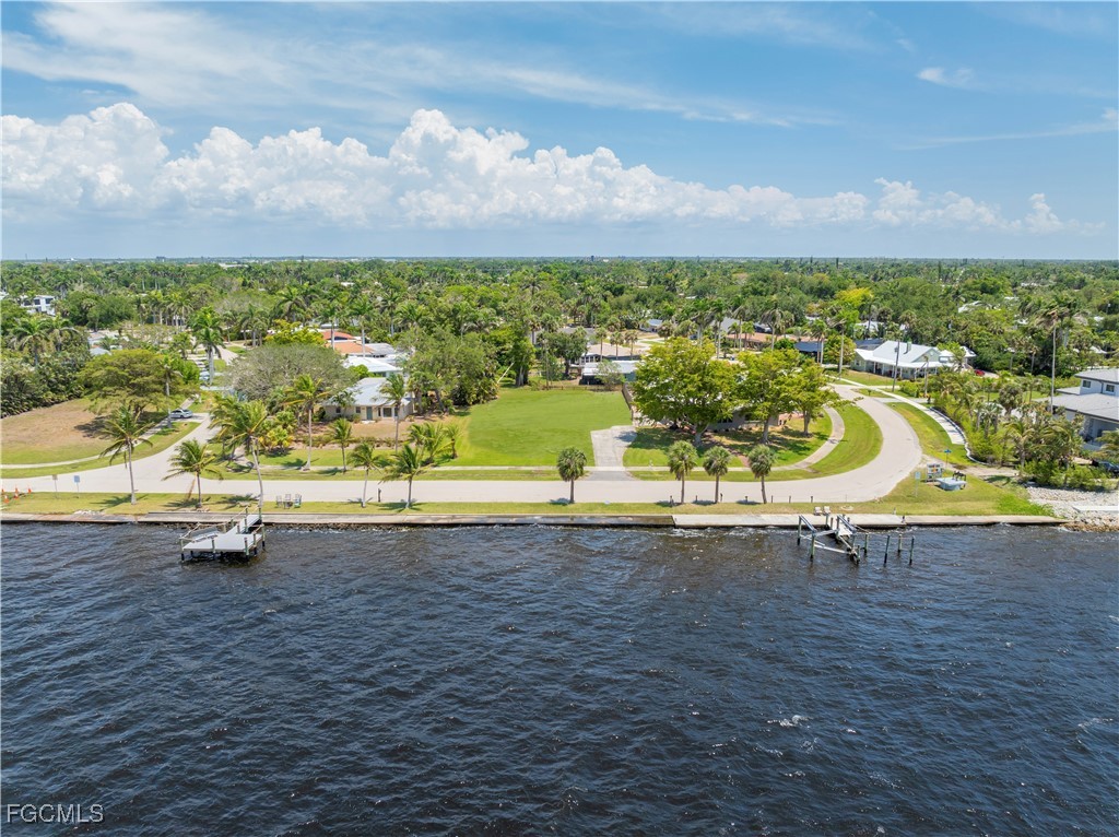 6105 West Riverside Drive Fort Myers, FL 33919 - Photo 3 of 8 a view of a lake with a nearby beach