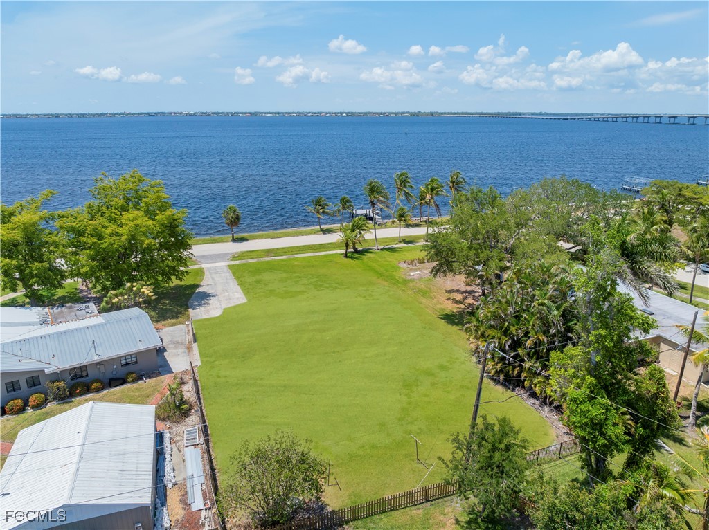 6105 West Riverside Drive Fort Myers, FL 33919 - Photo 5 of 8 a view of a lake in front of house