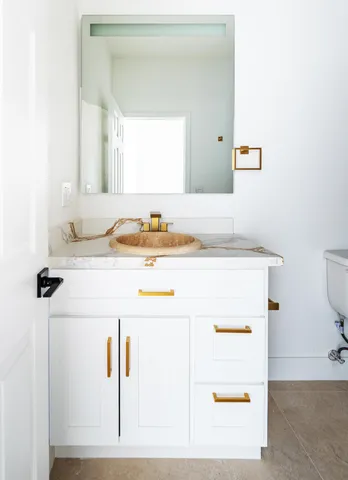 a bathroom with a sink and a mirror