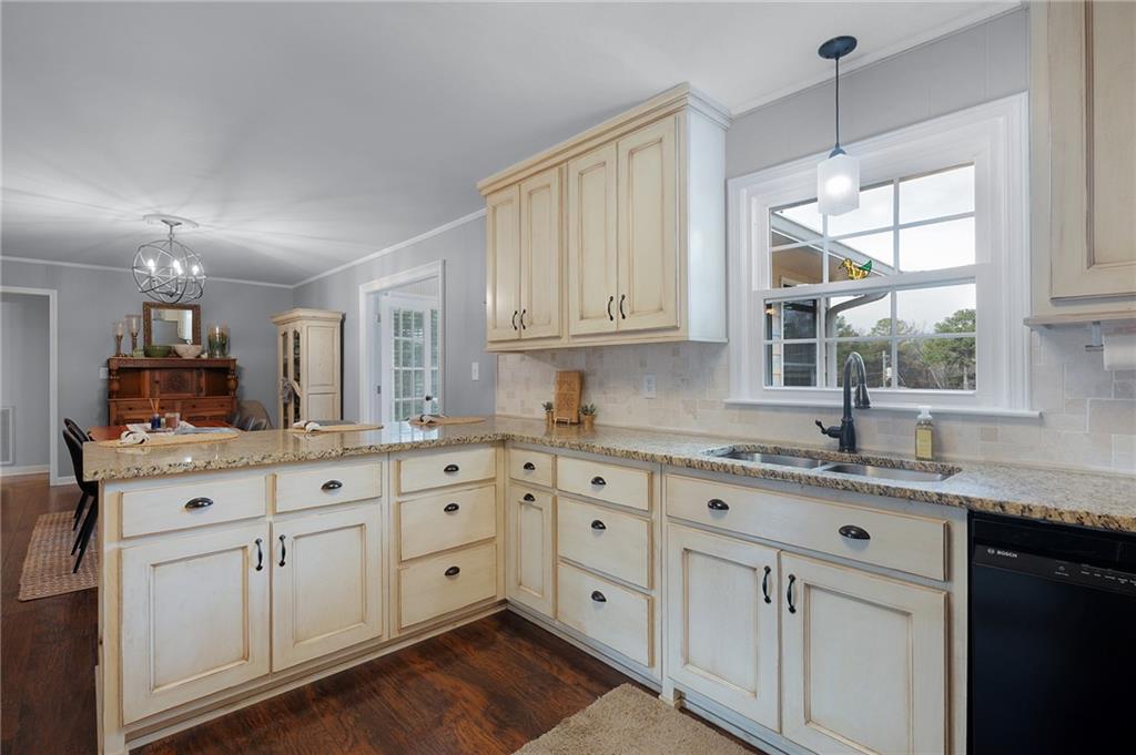 136 Meadow Lane Calhoun, GA 30701 - Photo 11 of 34 a kitchen with white cabinets and sink