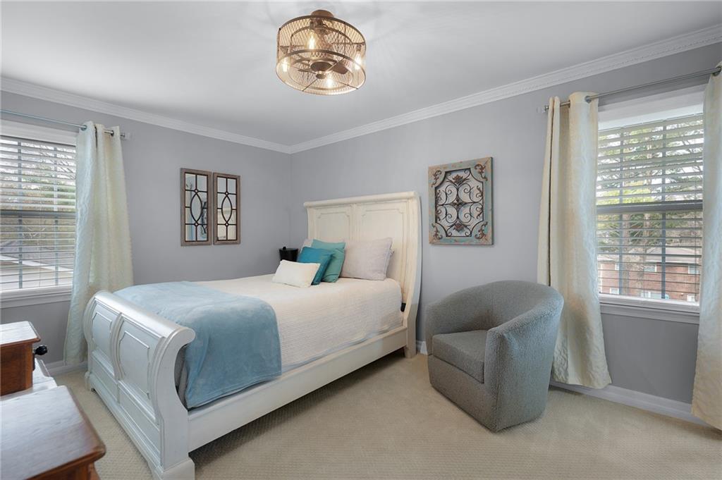 136 Meadow Lane Calhoun, GA 30701 - Photo 22 of 34 a bedroom with a bed and a couch