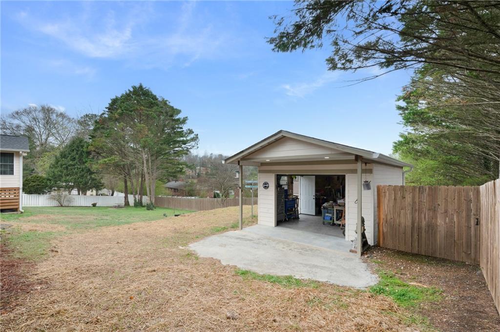 136 Meadow Lane Calhoun, GA 30701 - Photo 27 of 34 a view of a house with a yard and garage