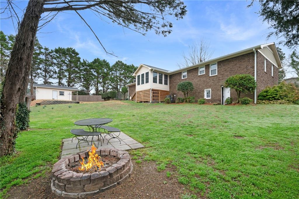 136 Meadow Lane Calhoun, GA 30701 - Photo 28 of 34 a view of a house with a yard porch and sitting area