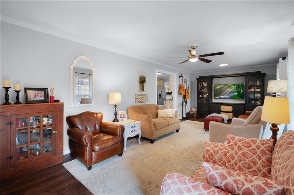 136 Meadow Lane Calhoun, GA 30701 - Photo 3 of 34 a living room with furniture a ceiling fan and a window