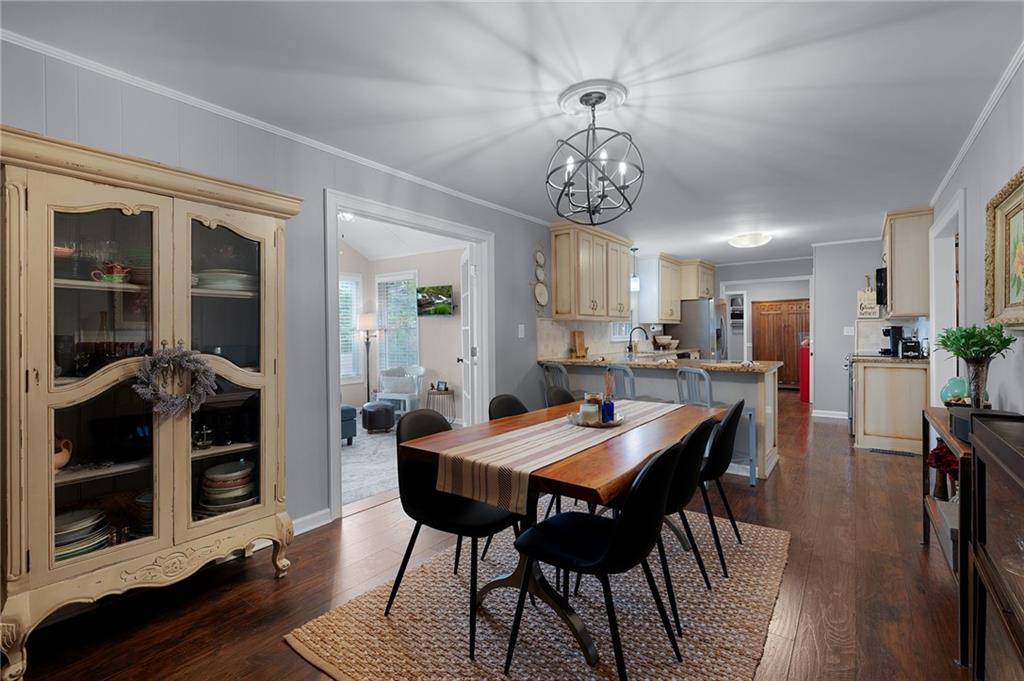 136 Meadow Lane Calhoun, GA 30701 - Photo 8 of 34 a view of a dining room with furniture and wooden floor