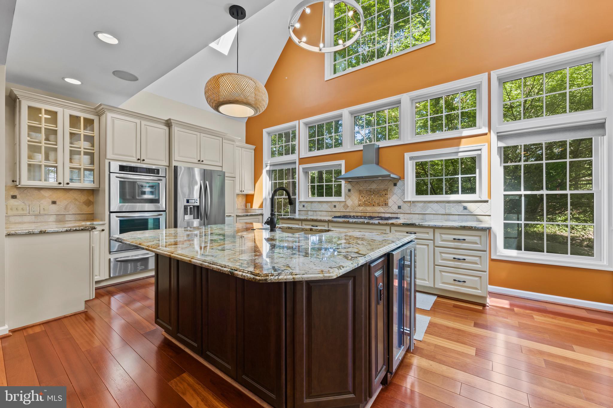 11019 Ring Road Reston, VA 20190 - Photo 17 of 78 a kitchen with stainless steel appliances granite countertop a table chairs and a large window