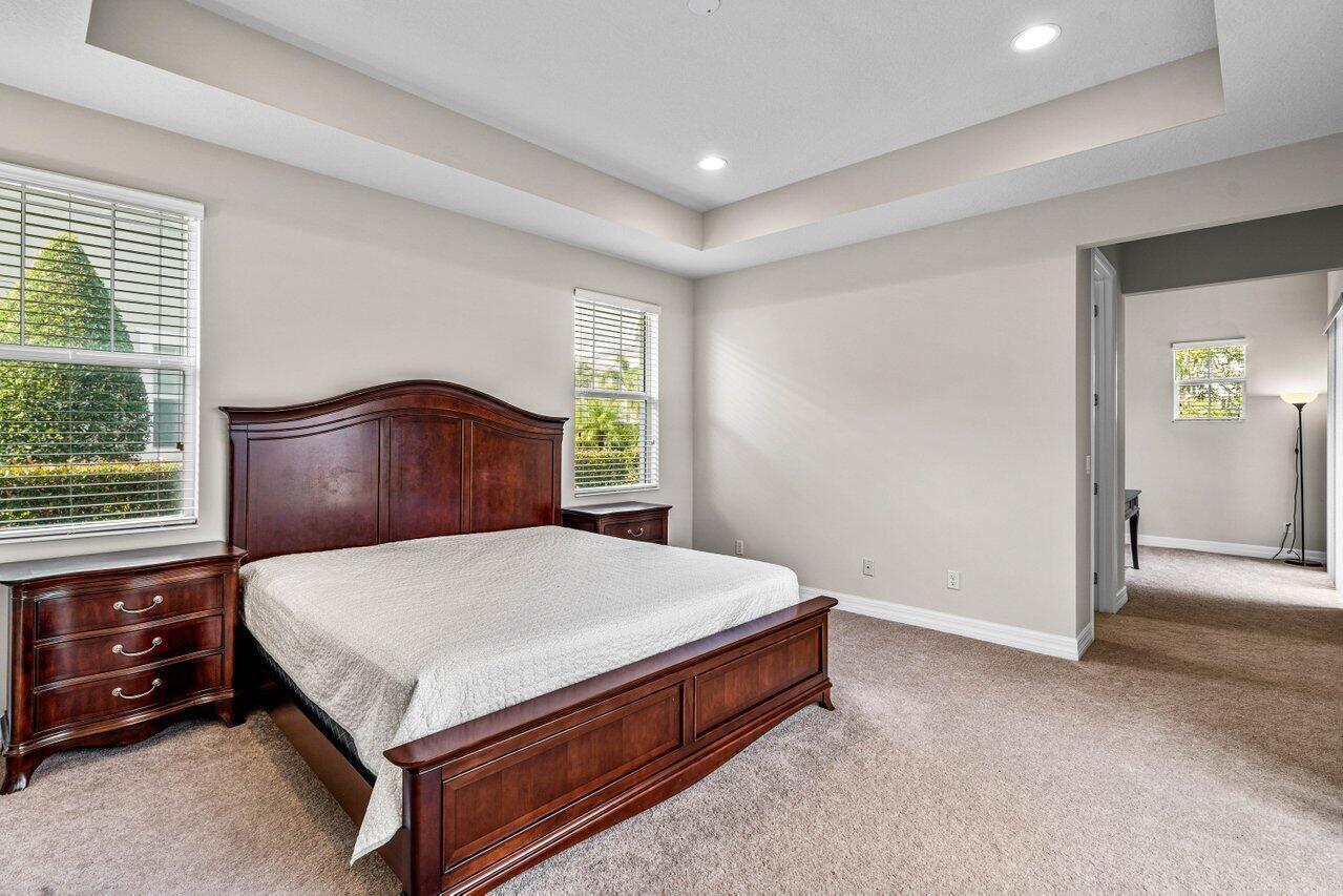 1131 North Prescott Drive Jupiter, FL 33458 - Photo 20 of 72 a bedroom with a bed and a window