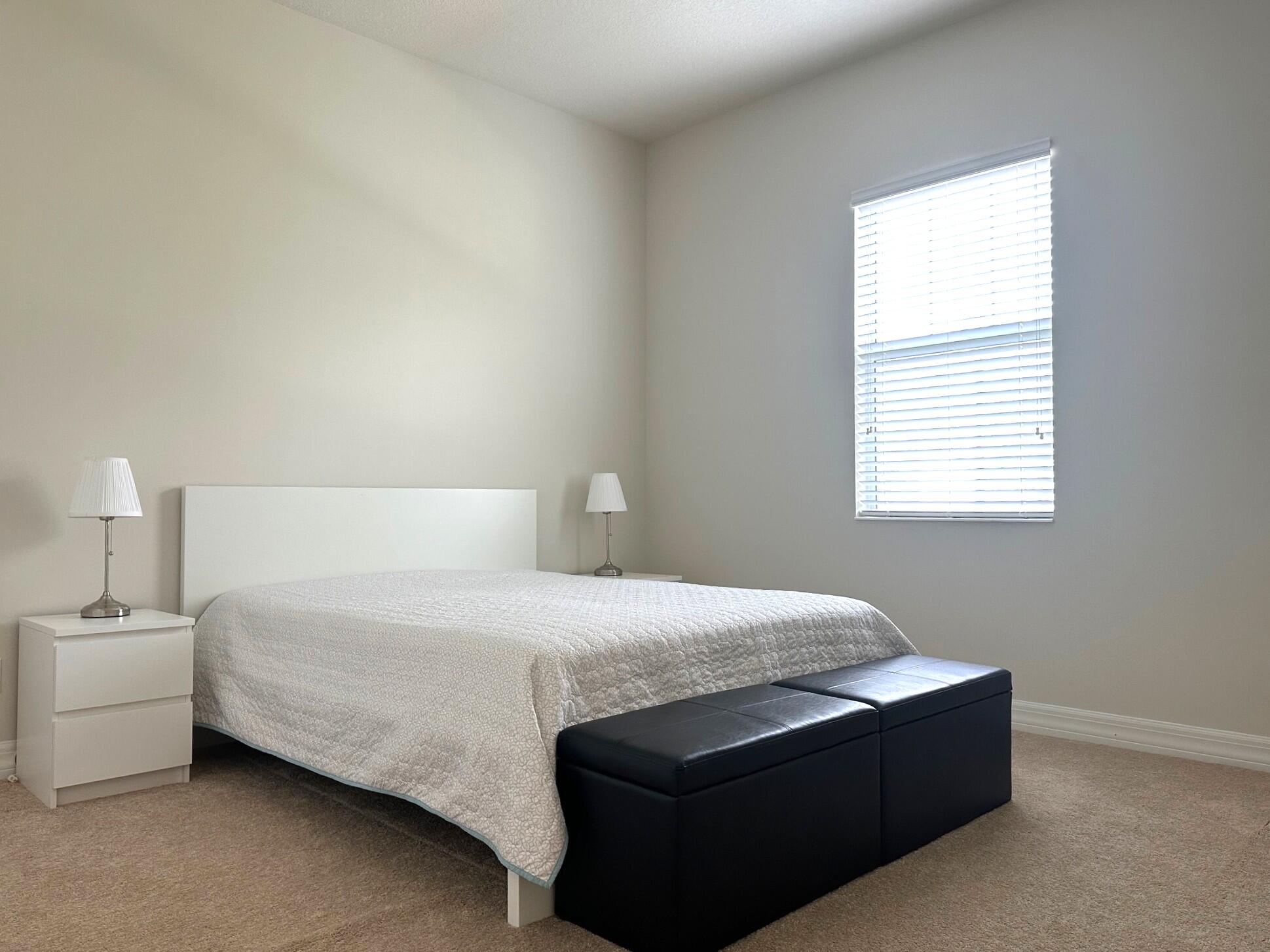 1131 North Prescott Drive Jupiter, FL 33458 - Photo 31 of 72 a bedroom with a bed and window