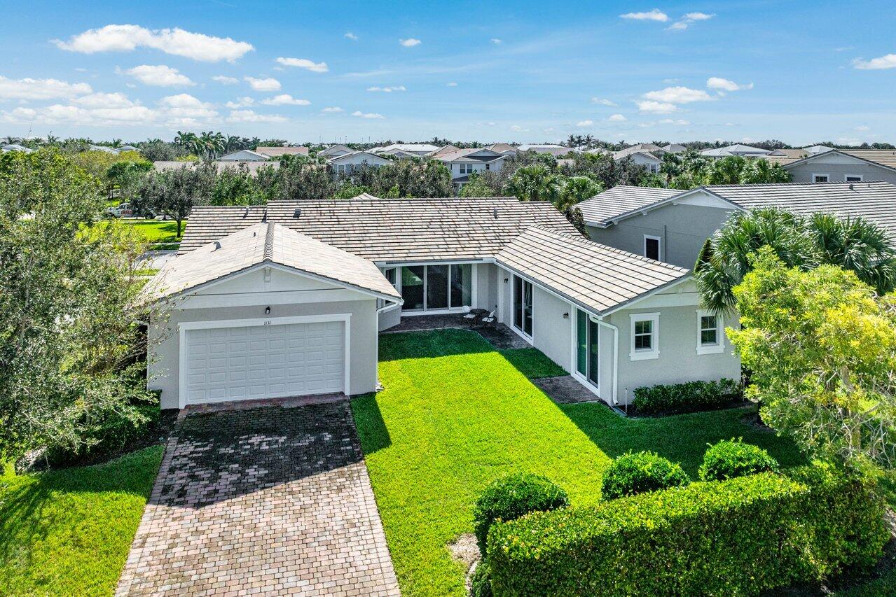 1131 North Prescott Drive Jupiter, FL 33458 - Photo 44 of 72 a aerial view of a house with a yard
