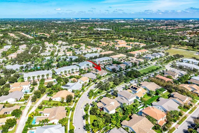 a view of a house with a yard and sitting area