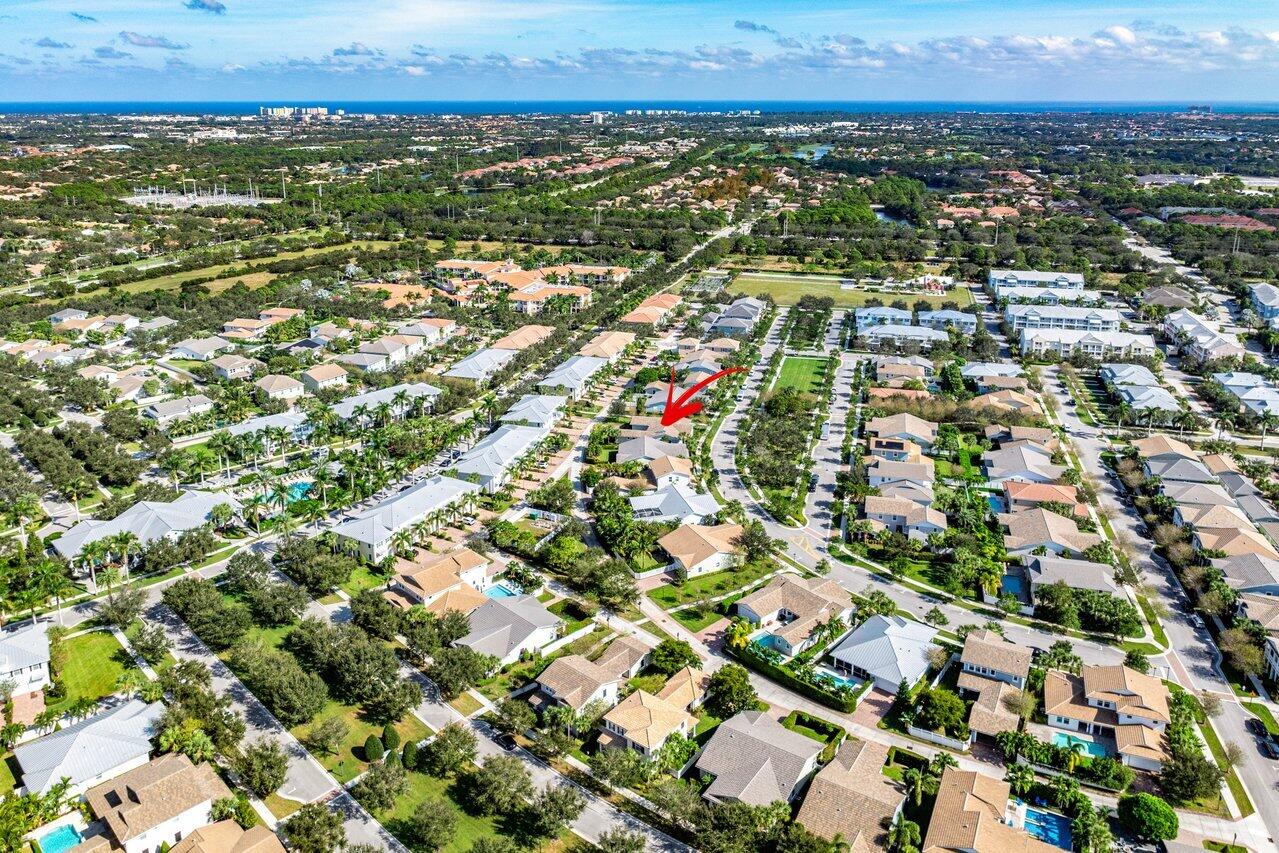 1131 North Prescott Drive Jupiter, FL 33458 - Photo 49 of 72 an aerial view of residential houses with outdoor space and trees