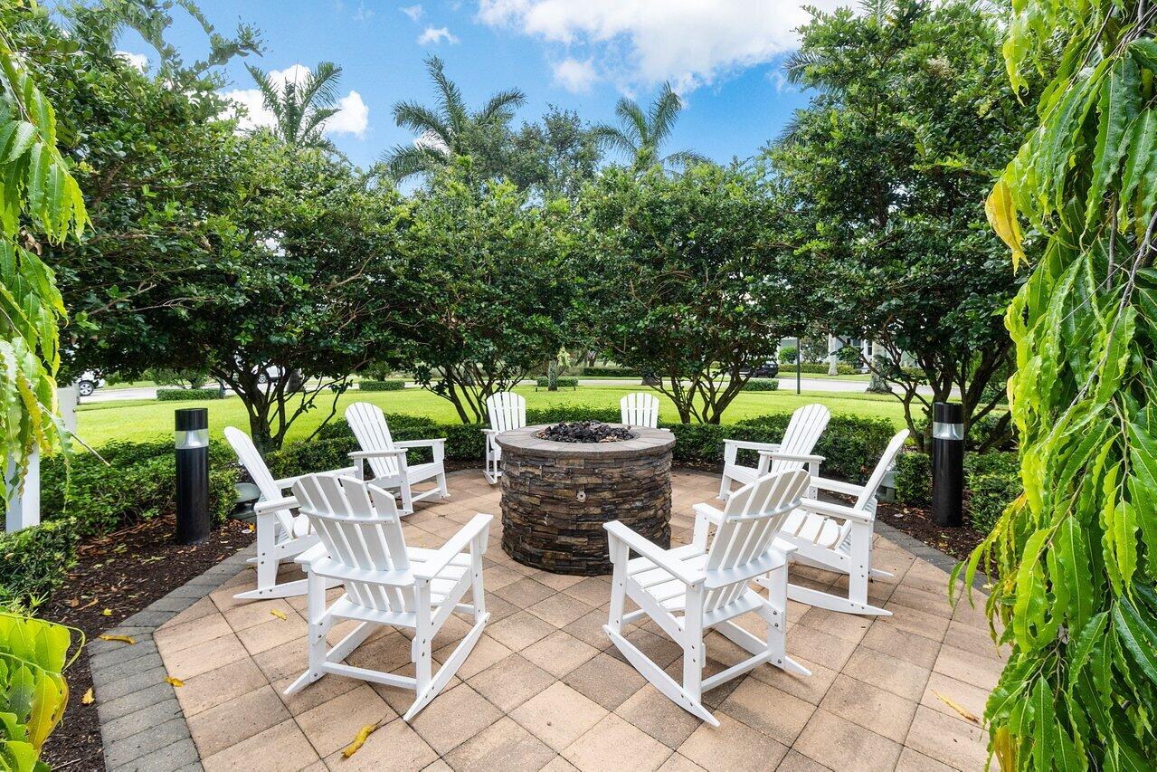 1131 North Prescott Drive Jupiter, FL 33458 - Photo 51 of 72 a view of an chairs and table in the patio