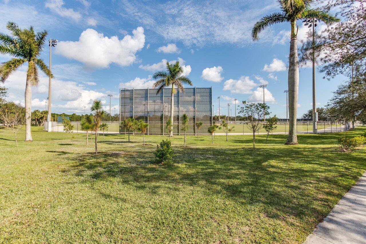 1131 North Prescott Drive Jupiter, FL 33458 - Photo 62 of 72 a view of a fountain in front of a house with a big yard