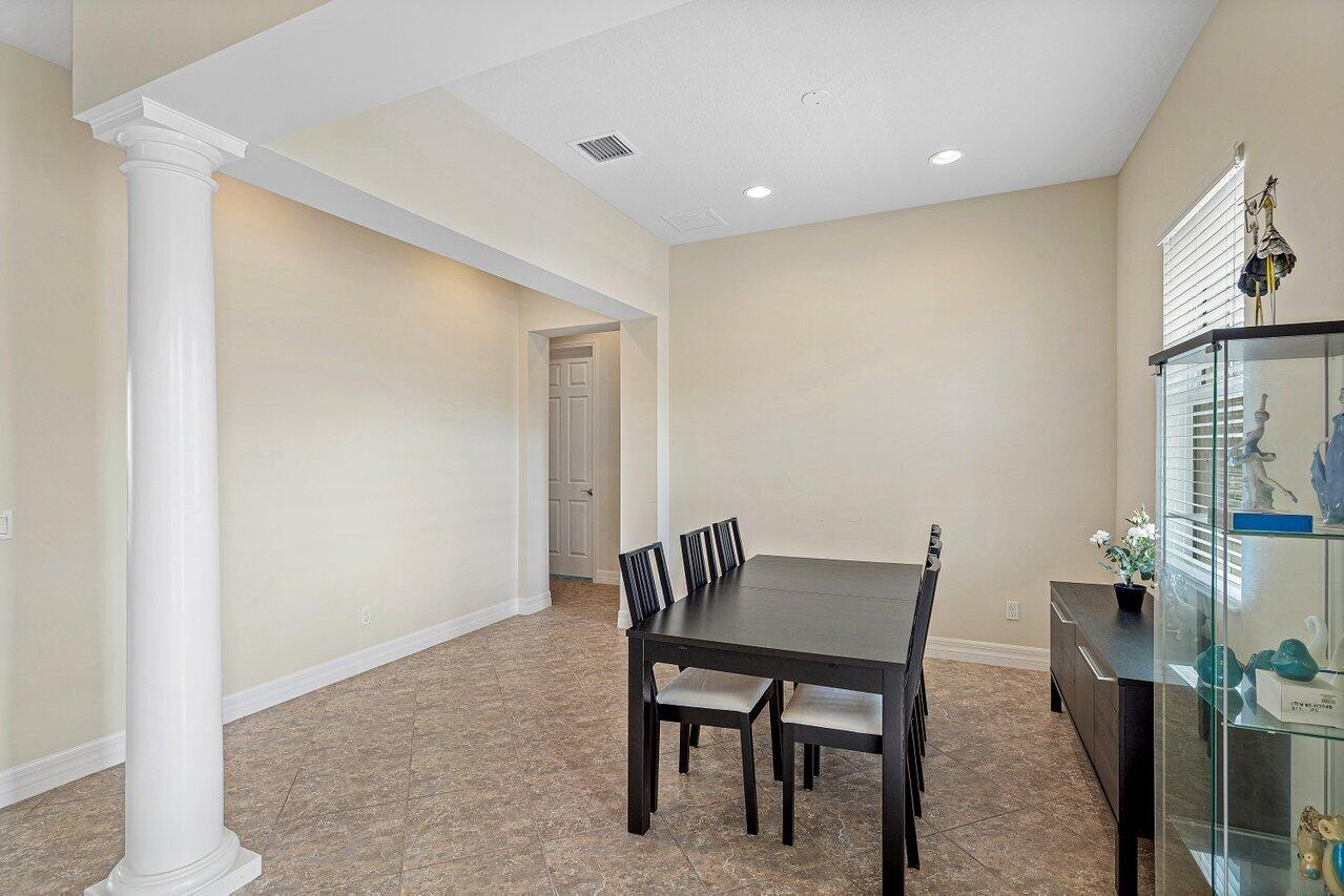 1131 North Prescott Drive Jupiter, FL 33458 - Photo 7 of 72 a view of a dining room with furniture