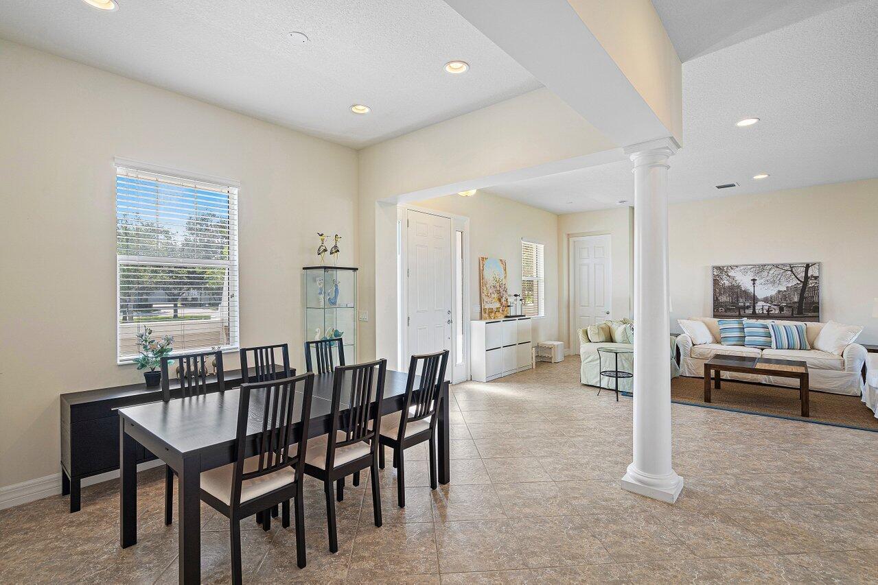 1131 North Prescott Drive Jupiter, FL 33458 - Photo 8 of 72 a view of a dining room with furniture and window