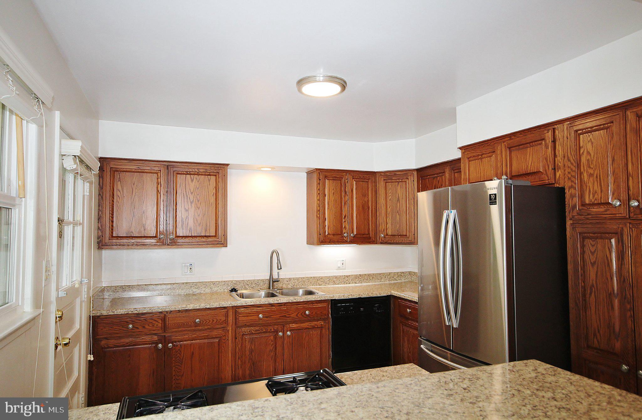 5504 Inverchapel Road Springfield, VA 22151 - Photo 6 of 51 Modern kitchen with warm wood accents.