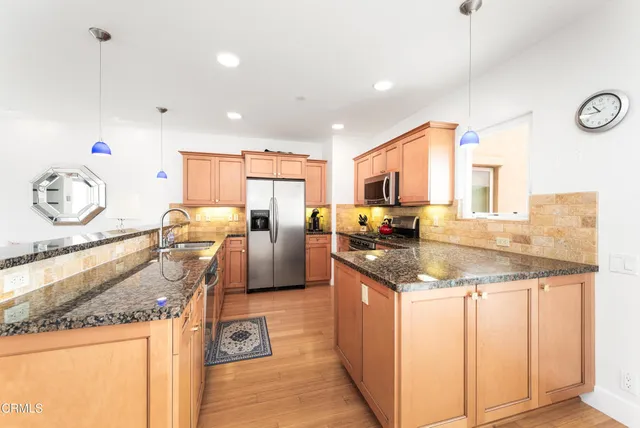 a kitchen with granite countertop lots of counter top space
