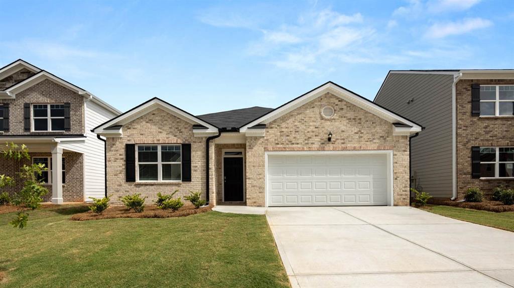 a front view of a house with a yard