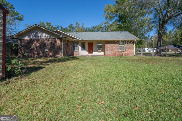front view of a house with a big yard