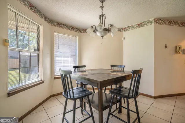 a view of a dining room with furniture window and outside view