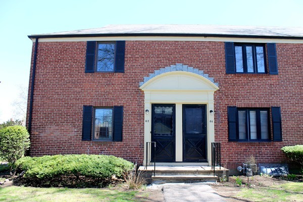 62 Pierce Road, Unit 62 Watertown, MA 02472 - Photo 13 of 14 a front view of a house with a garden