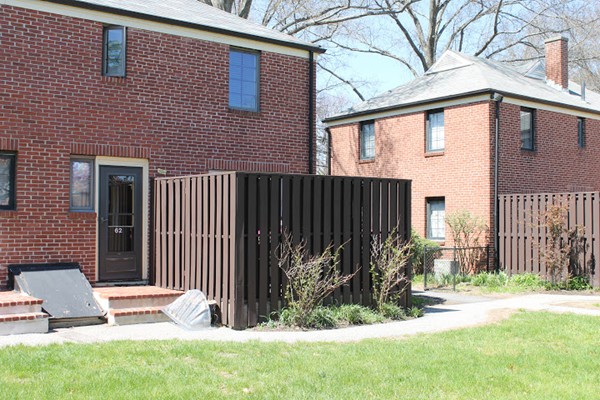 62 Pierce Road, Unit 62 Watertown, MA 02472 - Photo 14 of 14 a view of a backyard with plants and fence