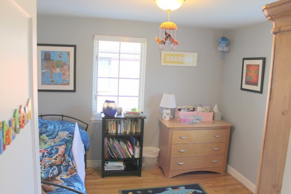 62 Pierce Road, Unit 62 Watertown, MA 02472 - Photo 9 of 14 a room with furniture and painting on the wall