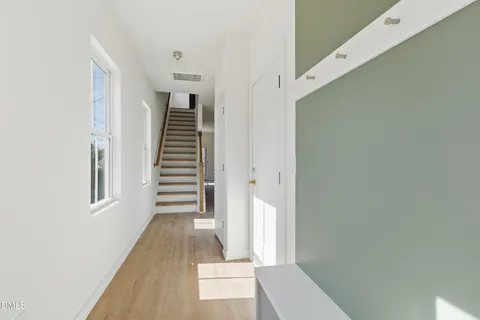 an aerial view of a house with a yard and garage