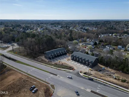 a bedroom with a bed chair and window
