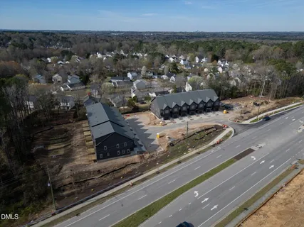 a view of a wooden door with a bench