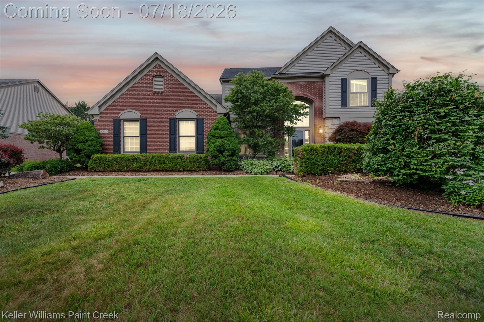 4230 Holly Lane Rochester, MI 48306 - Photo 2 of 64 Brick and siding exterior featuring a prominent arched entryway