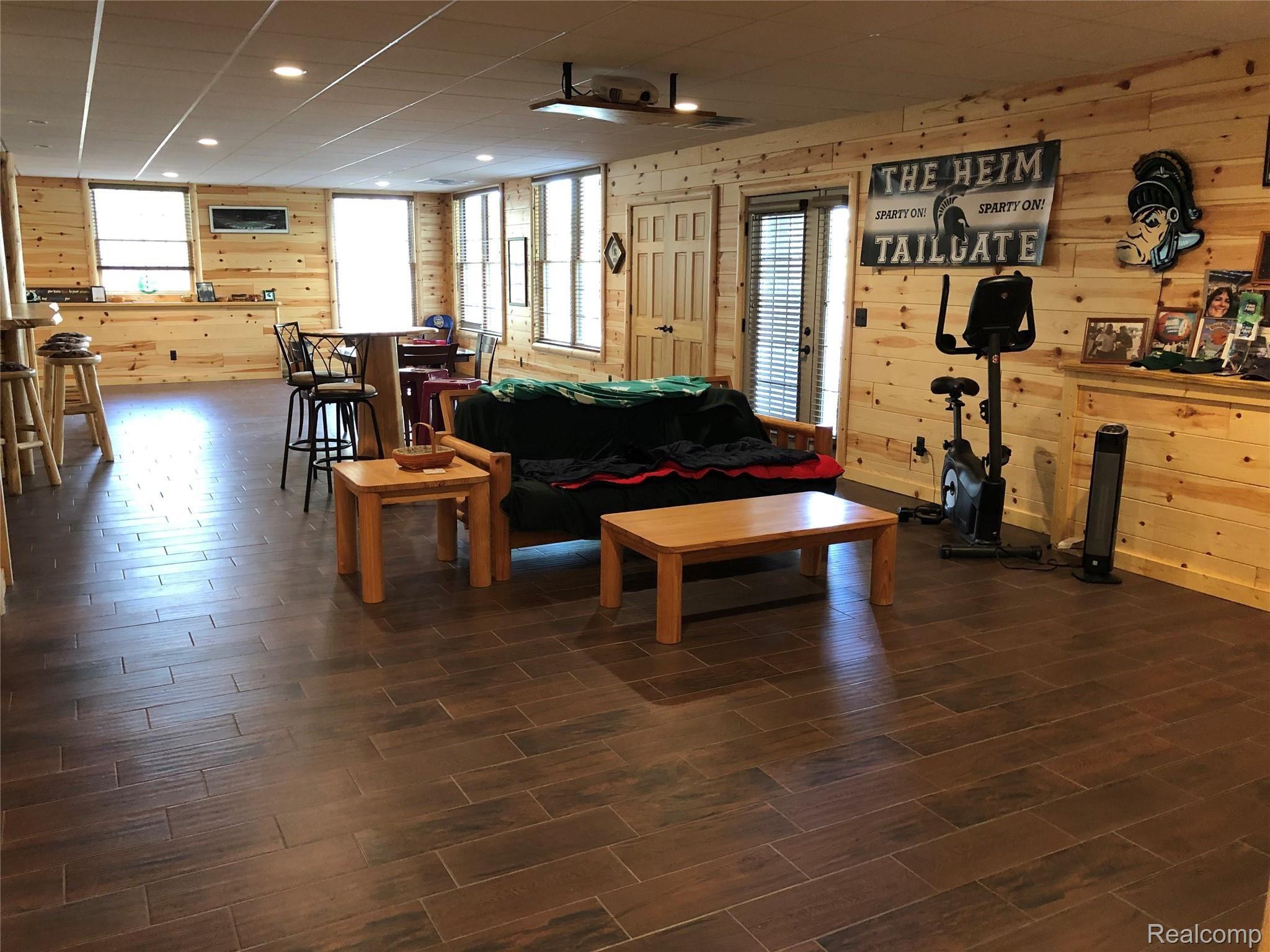 6263 General Squier Road Almont, MI 48003 - Photo 27 of 45 Fully finished basement features large area to entertain with a full kitchen, full bath and additional bedroom. Private entrance makes this a perfect potential mother-in-law suite