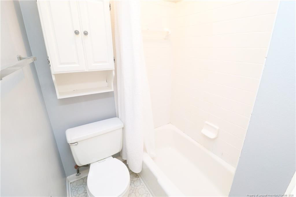 4909 Auburn Road Raleigh, NC 27609 - Photo 25 of 33 a white toilet sitting next to a shower