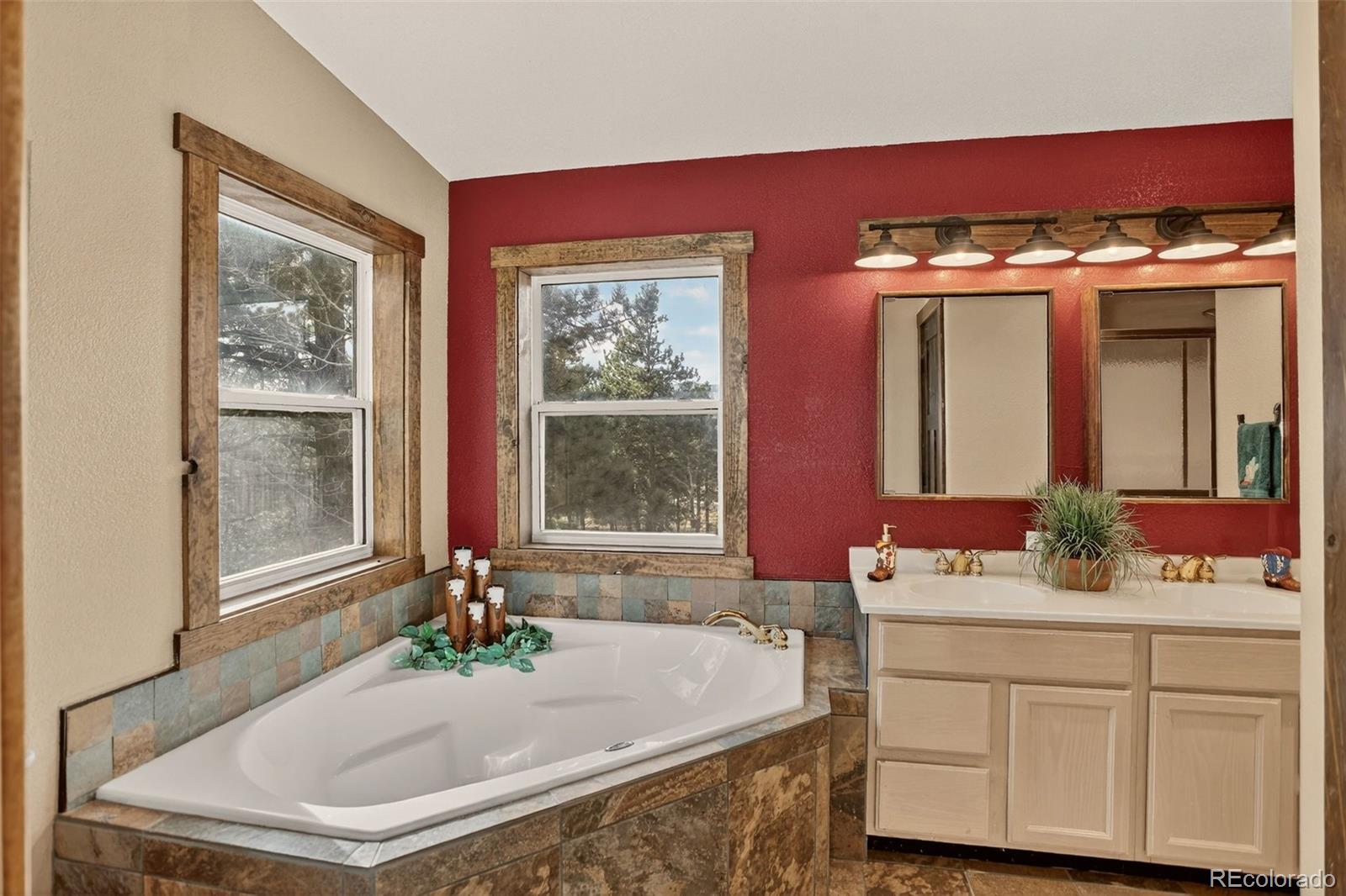 50 Rd P78 Bailey, CO 80421 - Photo 16 of 48 a bathroom with a tub sink and mirror