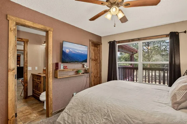 a bedroom with a large bed and a large window