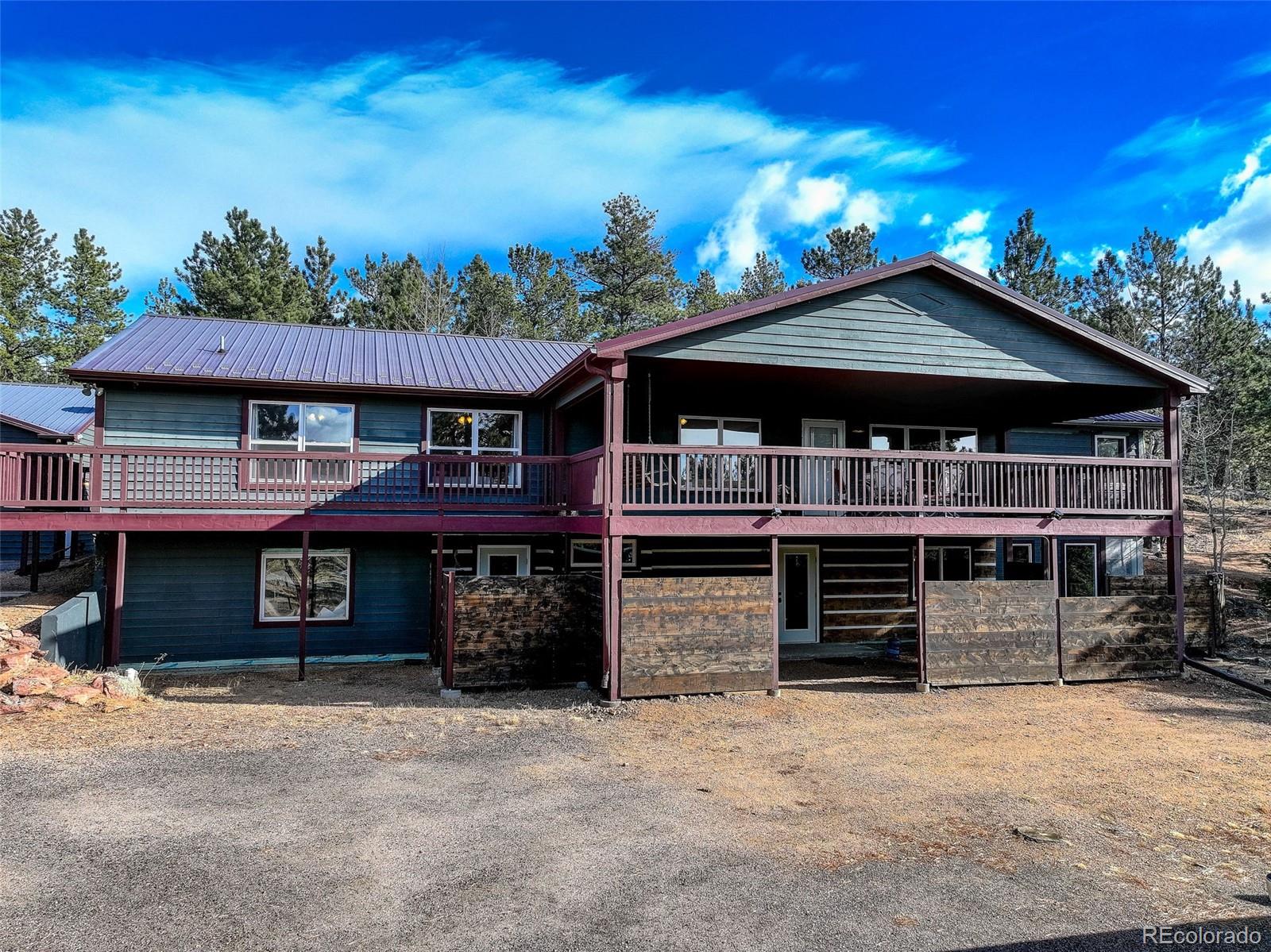 50 Rd P78 Bailey, CO 80421 - Photo 2 of 48 a front view of a house with a yard