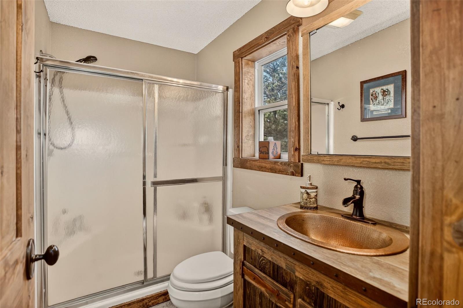 50 Rd P78 Bailey, CO 80421 - Photo 22 of 48 a bathroom with a granite countertop sink toilet and shower