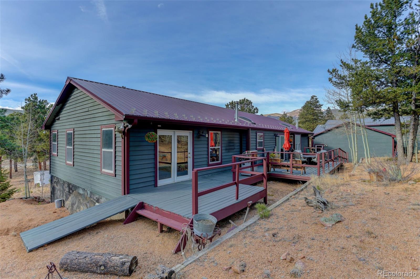 50 Rd P78 Bailey, CO 80421 - Photo 26 of 48 a view of a house with a patio and a yard