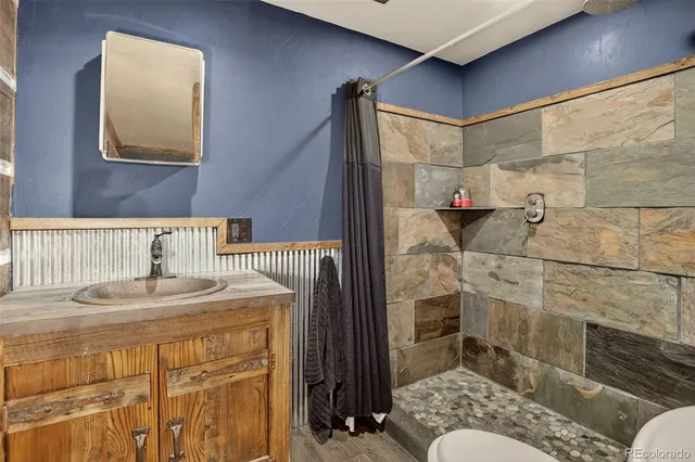 a bed sitting in a room next to a lamp