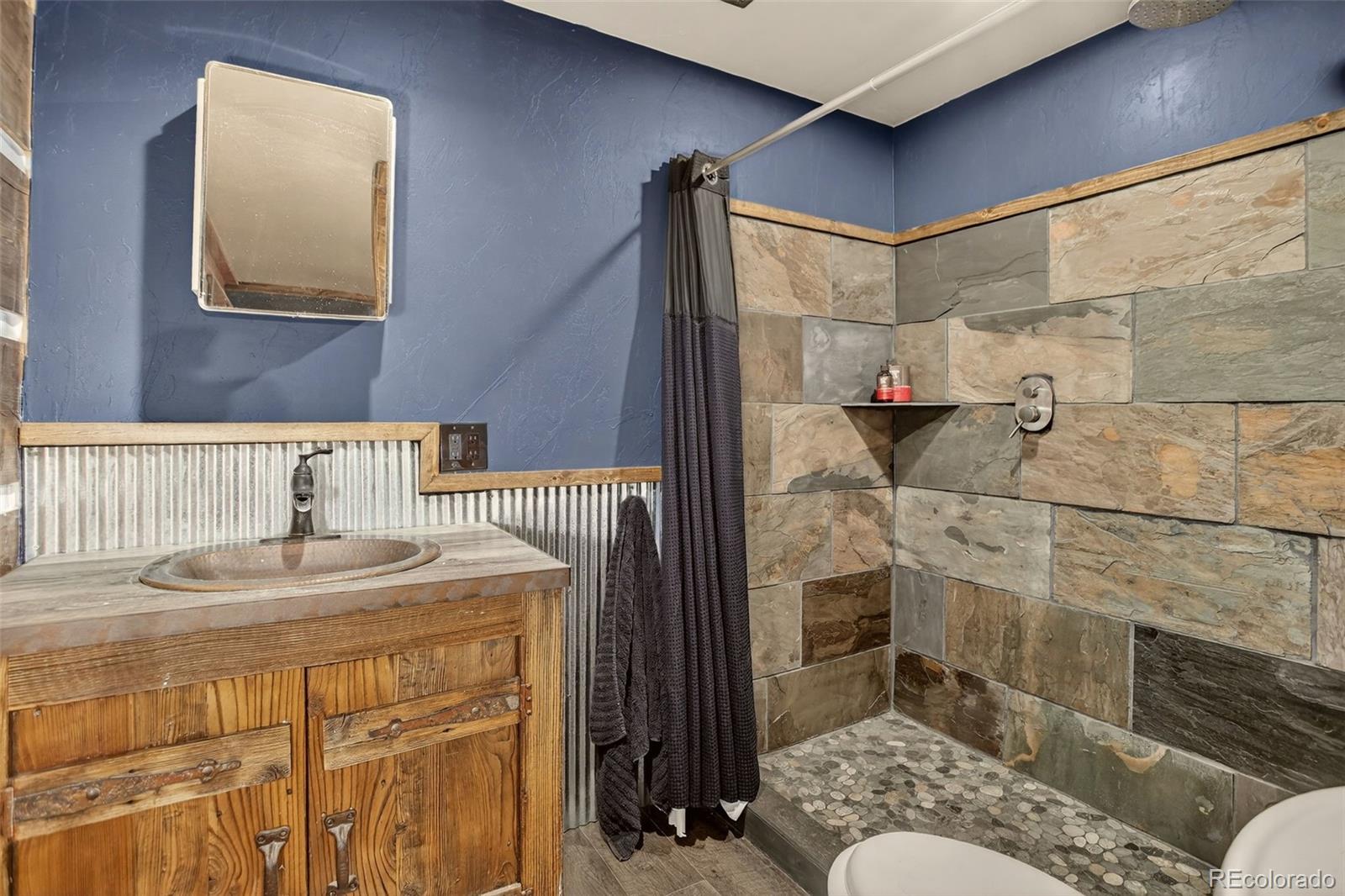 50 Rd P78 Bailey, CO 80421 - Photo 37 of 48 a bathroom with a sink and a mirror