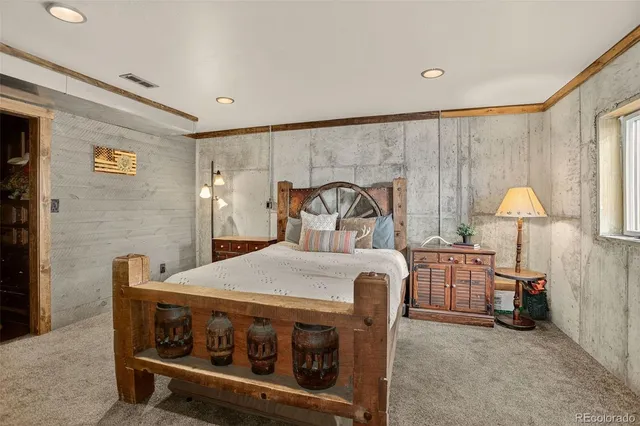 a bed room with a bed and a chair