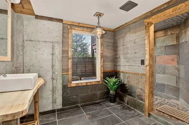 a bathroom with a glass shower door