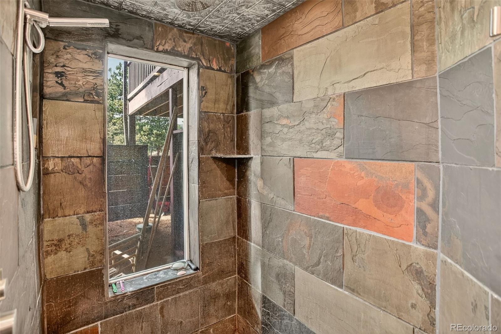 50 Rd P78 Bailey, CO 80421 - Photo 41 of 48 a bathroom with a glass shower door