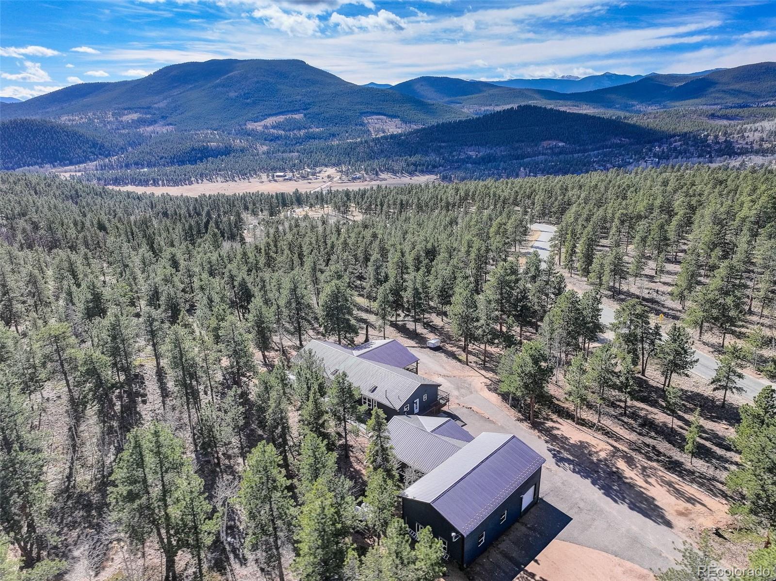 50 Rd P78 Bailey, CO 80421 - Photo 44 of 48 a view of a houses with a yard