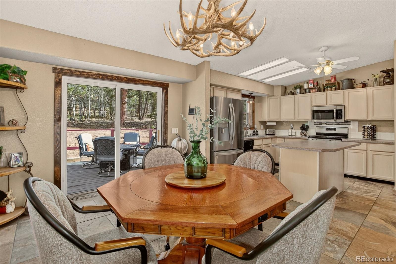 50 Rd P78 Bailey, CO 80421 - Photo 10 of 48 a kitchen with a dining table and chairs