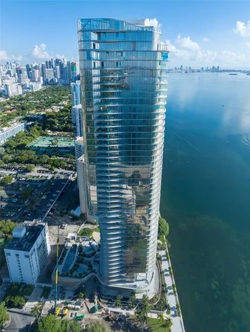 a view of a swimming pool with outdoor seating