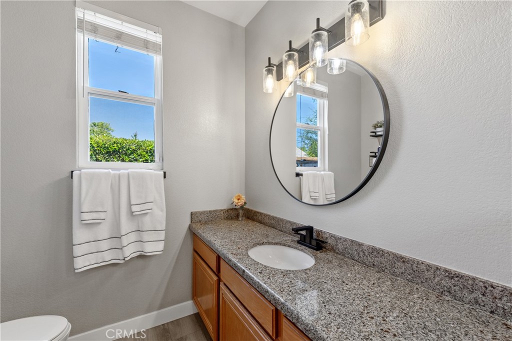 32985 Novara Court Temecula, CA 92592 - Photo 40 of 56 Bathroom With Granite Countertops And Updated Lighting